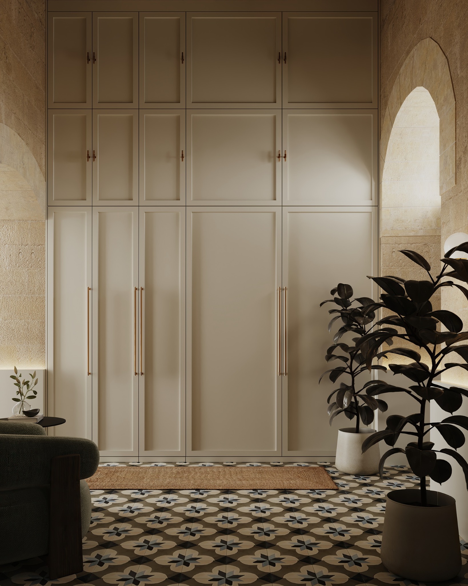Full-height fitted storage framed by limestone arches and patterned floor tiles