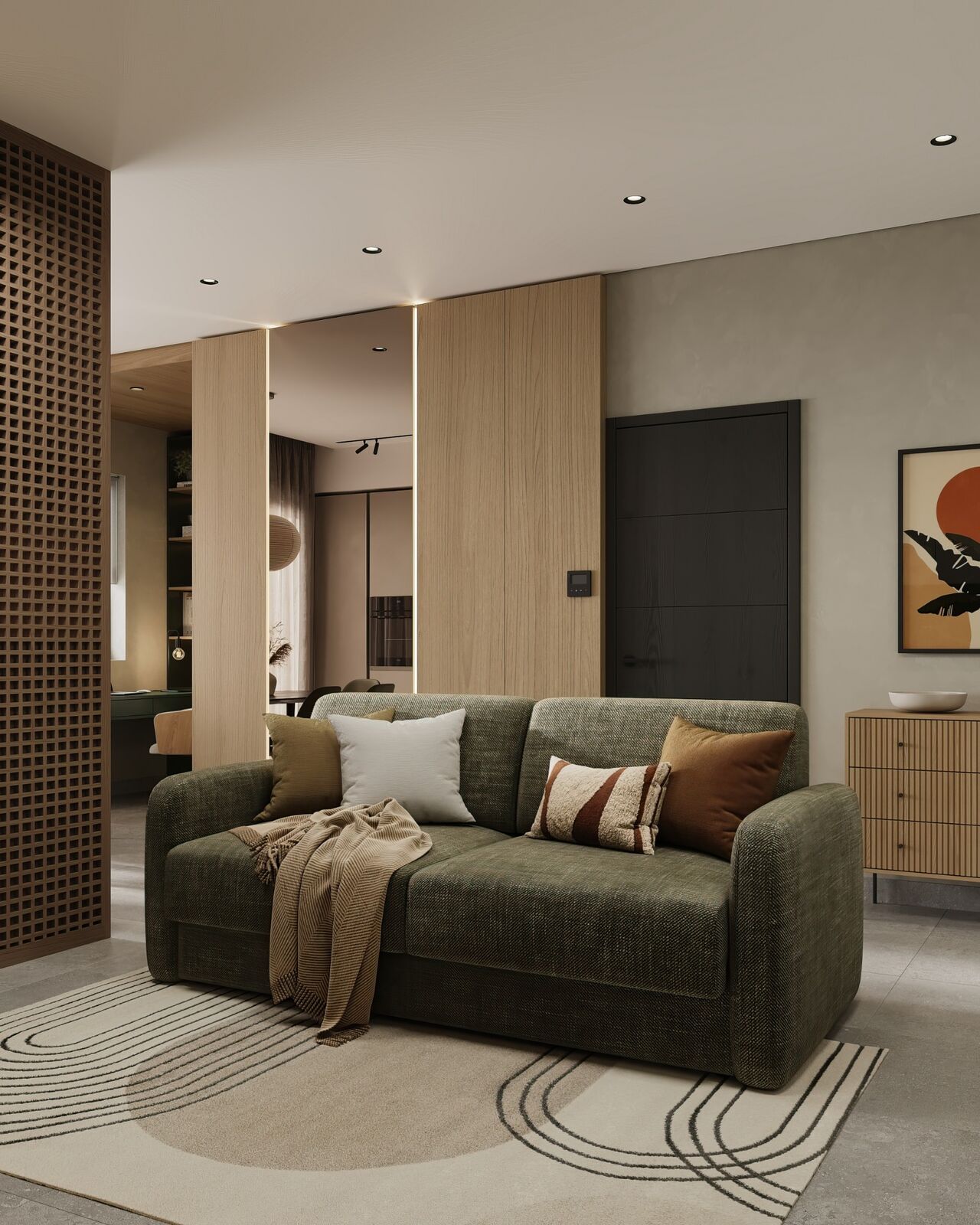 Studio apartment living area with green sofa