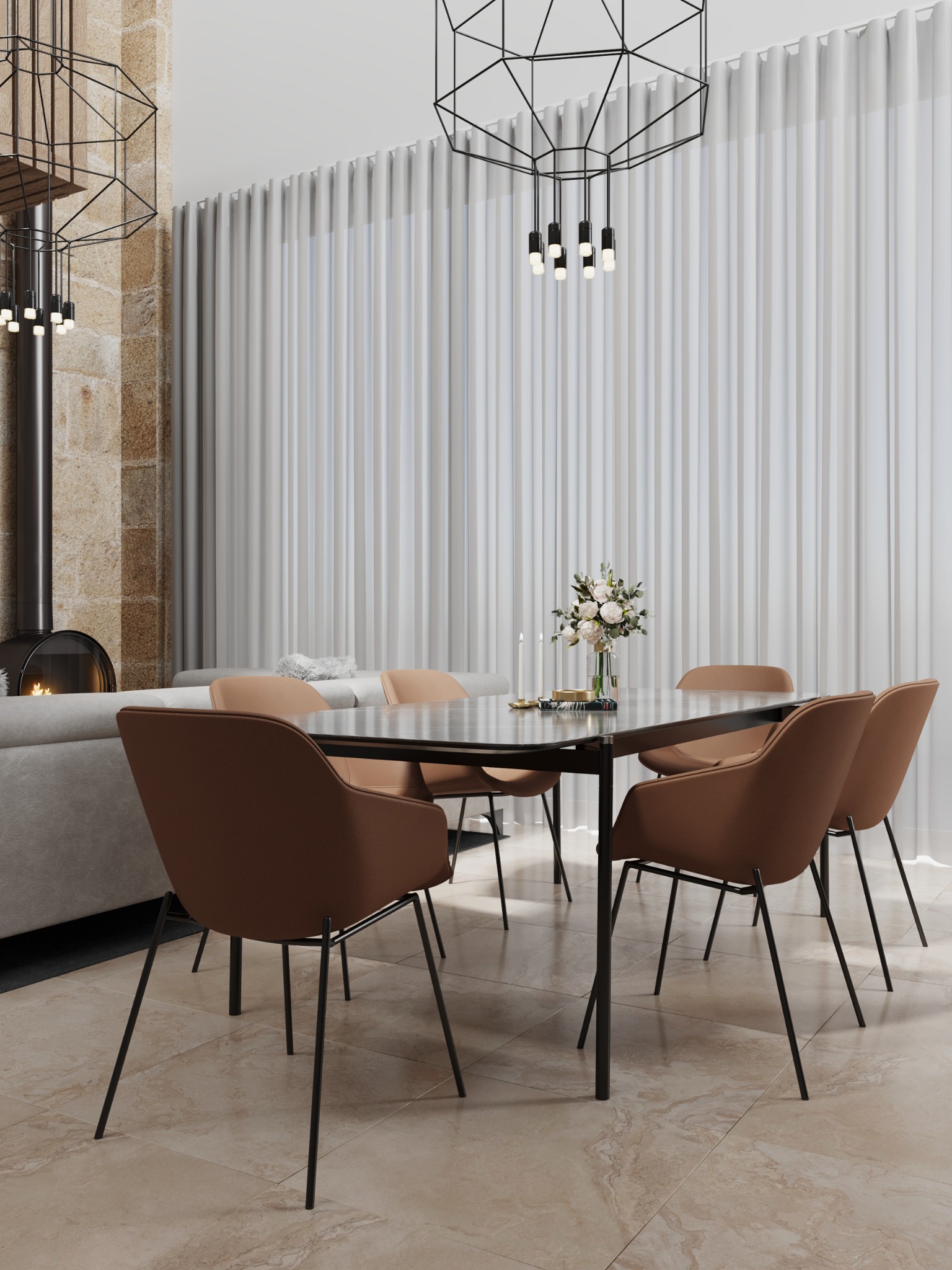 Dining table beneath geometric pendant lights beside a tall limestone wall