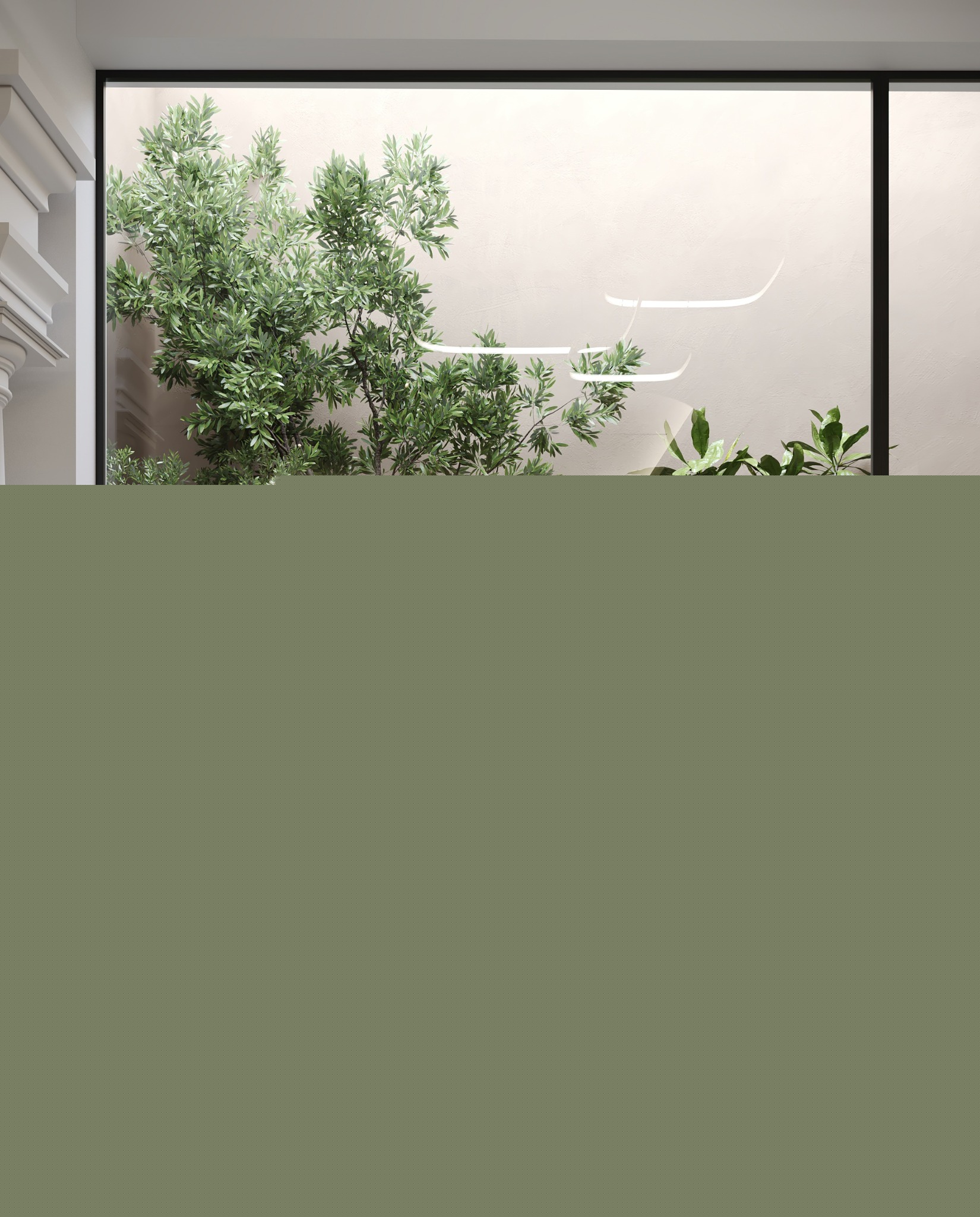 Glazed planted courtyard with lounge chairs