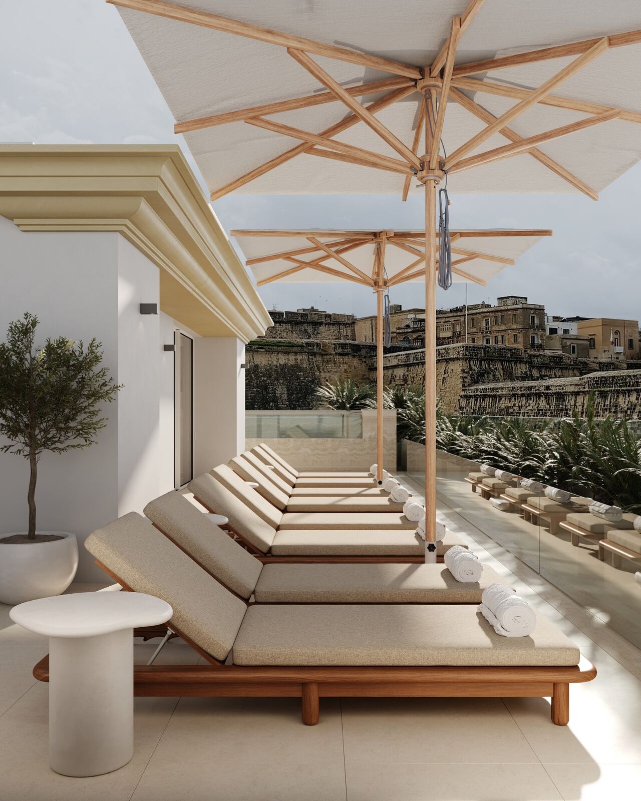 Row of loungers across the hotel pool terrace