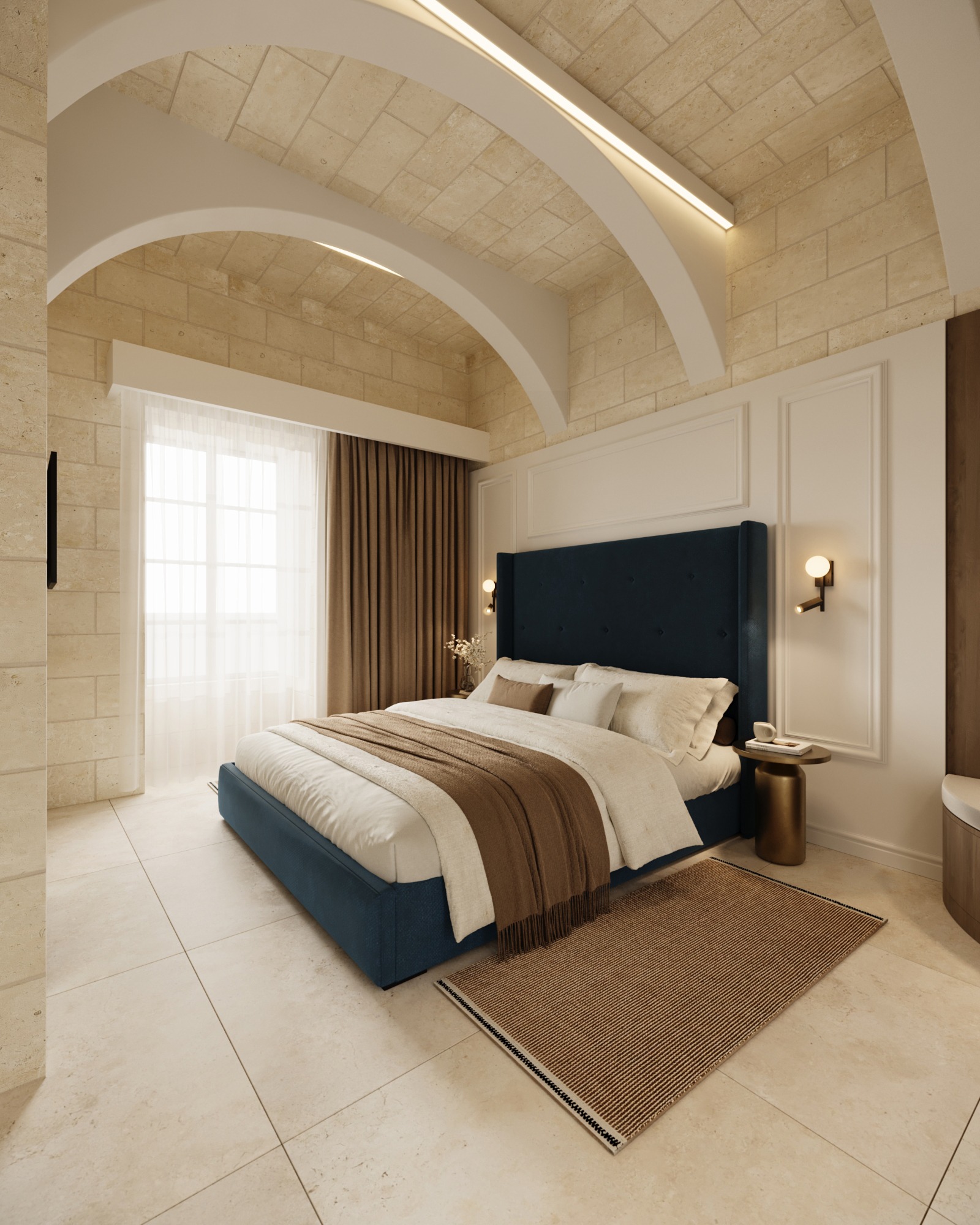 Boutique hotel bedroom with a deep blue upholstered bed beneath limestone vaults