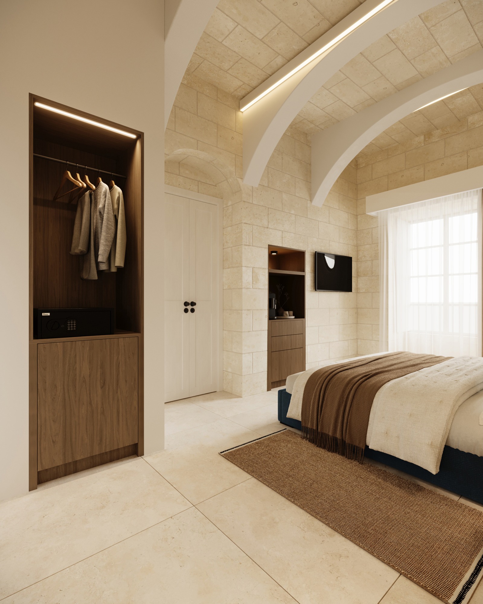 Open walnut wardrobe and compact refreshment station in the hotel bedroom