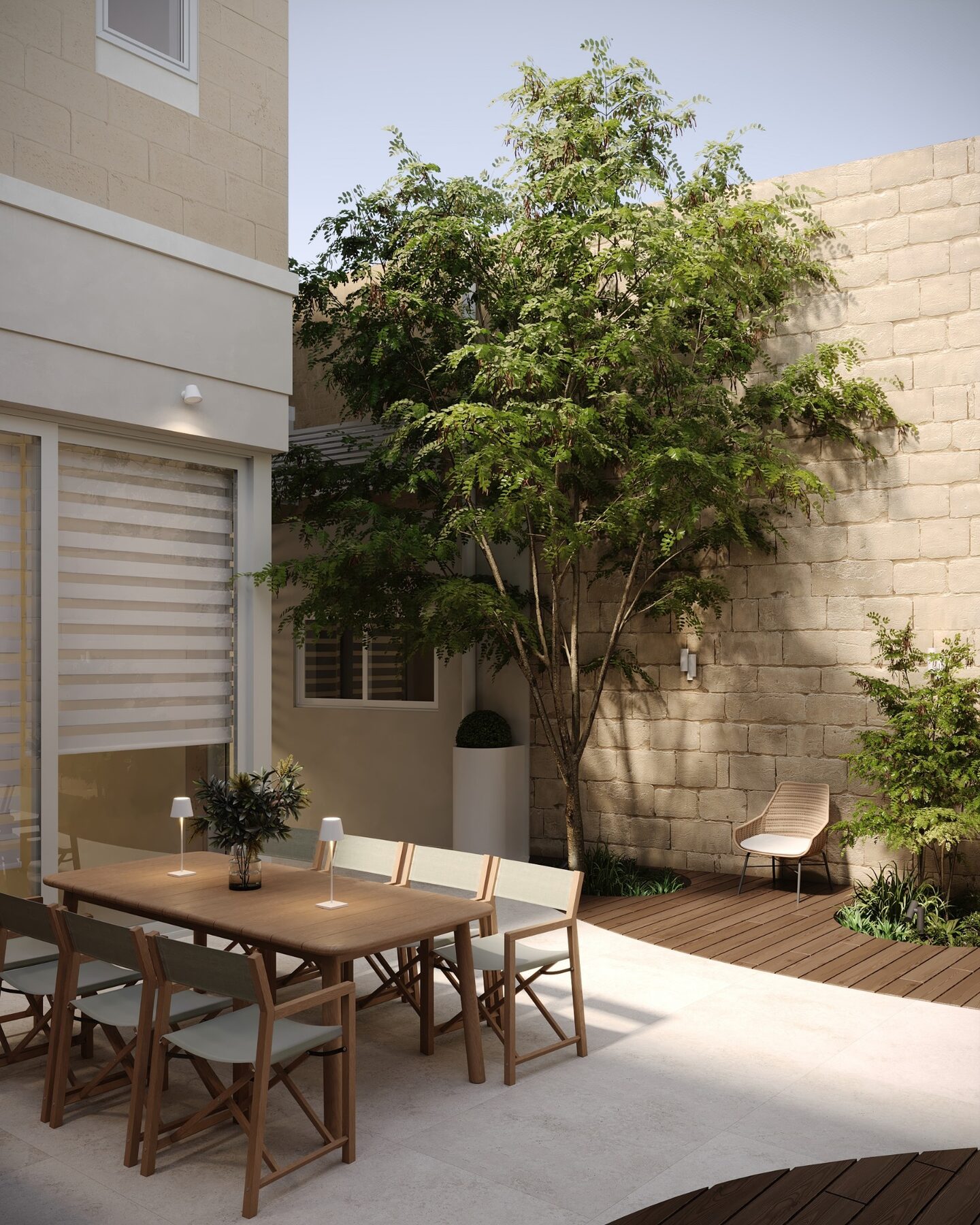 Mature tree framed by limestone courtyard walls